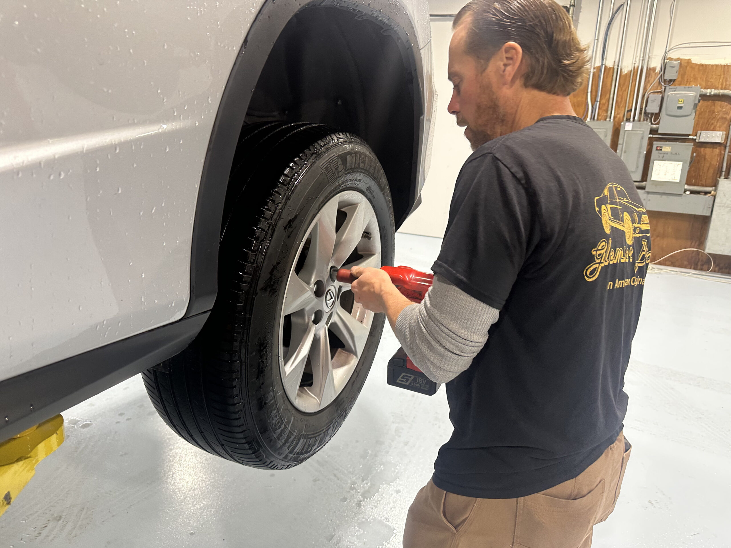 mechanic jason glemser replacing tire