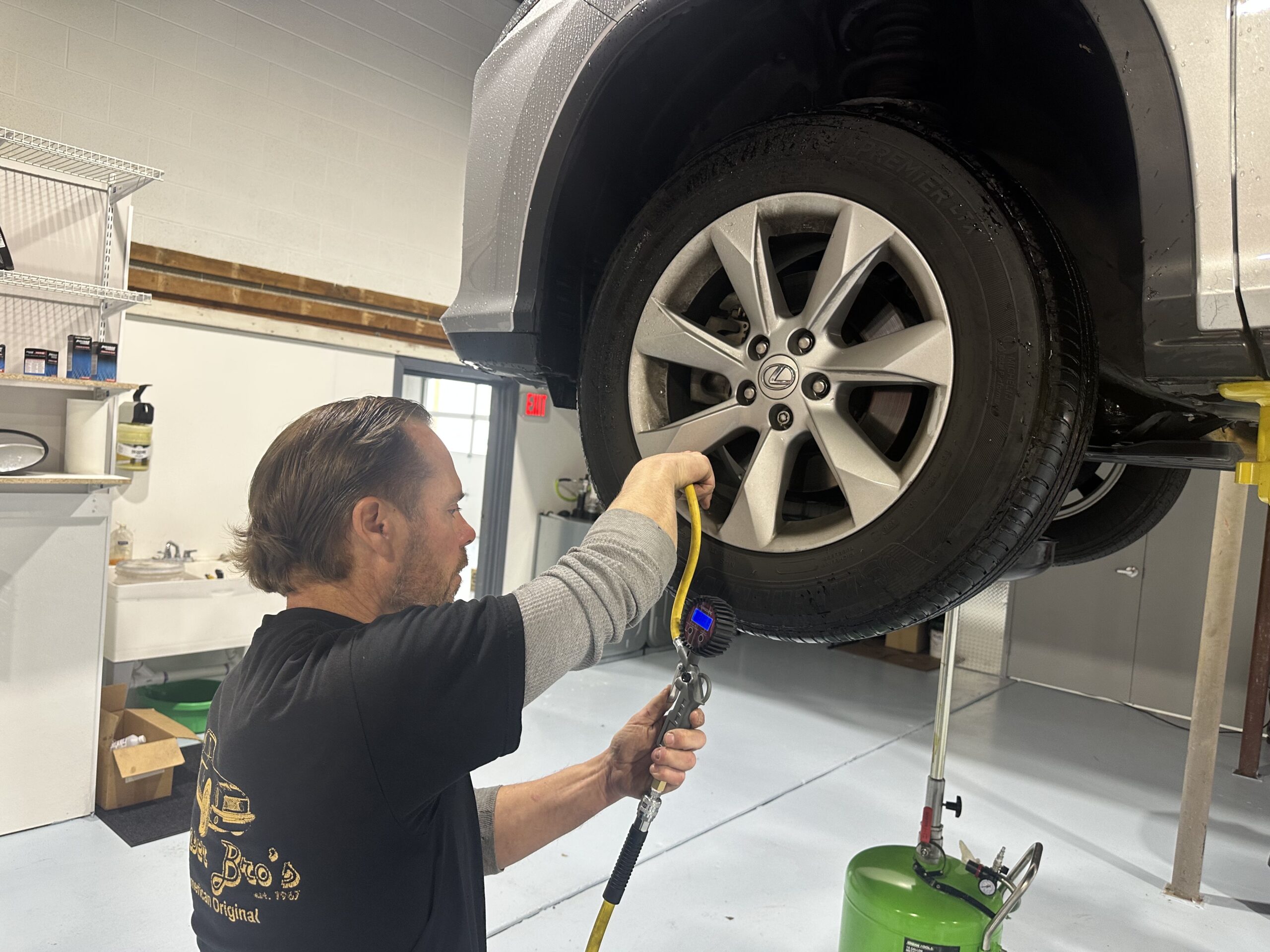 mechanic Jason Glemser inflates tires